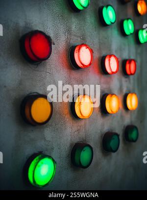 Array of colorful industrial signal lamp indicator on old electrical power control center panel Stock Photo