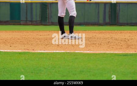 san pedro de macoris, dominican republic - july 12, 2021 - A young adult baseball player on the ball field Stock Photo