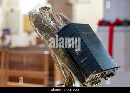 Bible on an ornate antique eagle lectern inside Portsmouth Cathedral. January 2025. Stock Photo