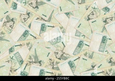 1 Brazilian real bills lies in big pile. Rich life conceptual background. Big amount of money. 1 Brazilian real bills lies in big pile. Rich life Stock Photo