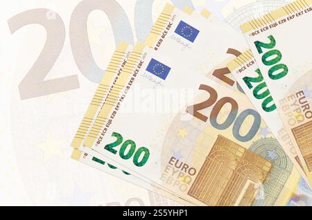 5 euro bills lies in stack on background of big semi-transparent
