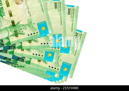 2000 Kazakhstani tenge bills lies in small bunch or pack isolated on white. Mockup with copy space. Business and currency exchange concept. 2000 Stock Photo