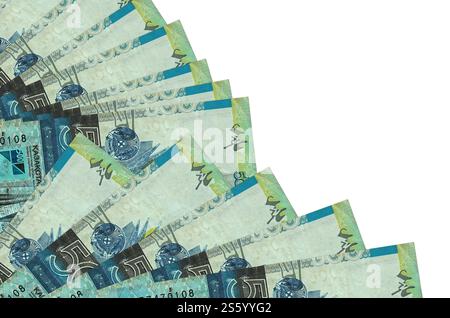 500 Kazakhstani tenge bills lies isolated on white background with copy space stacked in fan close up. Payday time concept or financial operations. Stock Photo
