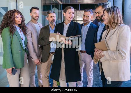 Business team brainstorming in modern office discussing project ideas together Stock Photo