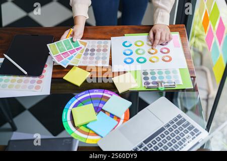 Creative idea Business female Artist Creative Designer sketch graphic drawing on graphic tablet and Color swatch samples Concept of idea creativity Stock Photo