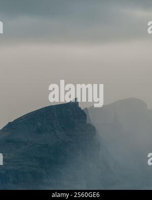 Close-up of a rugged mountain peak shrouded in mist in South Iceland. Stock Photo