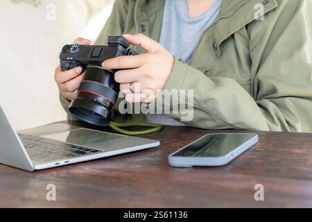 female checking a picture on digital camera Stock Photo