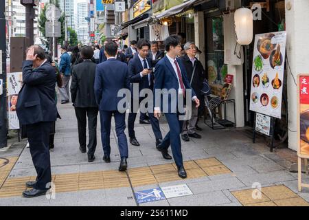 Japanese Office Workers in Suits at Lunchtime, Tokyo, Japan Stock Photo