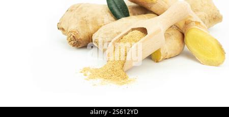 Fresh ginger root and ginger powder in wooden spoon isolated on white background, healthy spice, alternative medicine Stock Photo