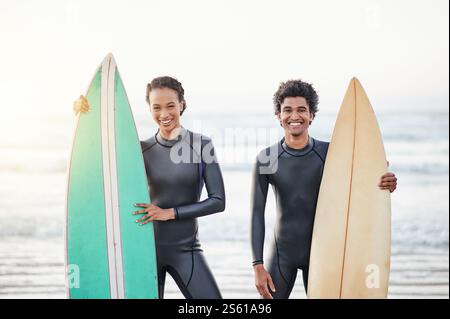 Portrait, sports and surfing friends on the beach together during summer for fun or recreation. Surfboard, water or workout with a man and woman Stock Photo