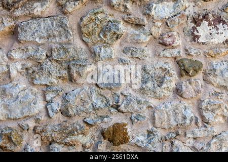 Stonewall. A stone wall made using concrete. Close up background. Stock Photo