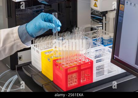 Scientist holding vial in scientific testing lab laboratory, New Jersey USA Stock Photo