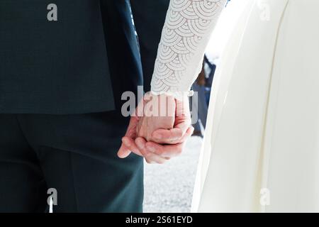 A newly wed couple holding hands Stock Photo