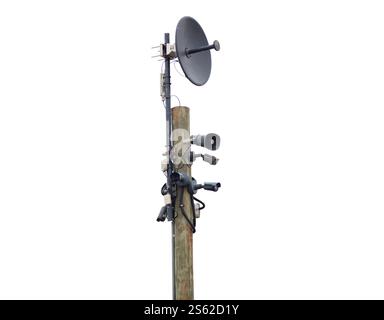 Wooden pole equipped with devices for surveillance and communication isolated on white background Stock Photo