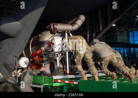 Cheyenne, Wyoming, USA. 10th Jan, 2025. U.S. Air Force Airmen assigned to the 153rd Airlift Wing load and install the Modular Airborne Fire Fighting Systems, or MAFFS, on to a C-130H Hercules aircraft in Cheyenne, in preparation to support firefighting efforts in the Los Angeles area. U.S. Northern Command activated three Wyoming Air National Guard C-130s equipped with MAFFS and associated personnel to assist firefighting efforts in California. MAFFS, developed by the U.S. Forest Service, are portable fire-retardant delivery systems that convert C-130s into airtankers, capable of releasing u Stock Photo