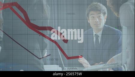 Image of red lines and financial data processing over diverse business people in office Stock Photo