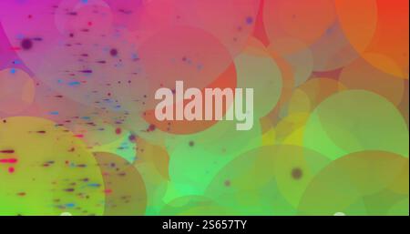 Image of colourful light spots moving over soft pink and green background Stock Photo