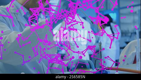 Image of network of connections over caucasian male scientist in laboratory Stock Photo
