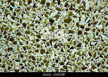 Broken recycled glass set in a concrete cement terrazzo flooring tile design. Stock Photo