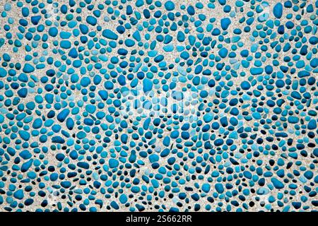 Broken recycled glass set in a concrete cement terrazzo flooring tile design. Stock Photo