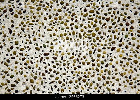 Broken recycled glass set in a concrete cement terrazzo flooring tile design. Stock Photo