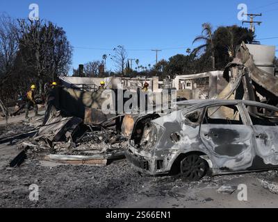 (250116) -- LOS ANGELES, Jan. 16, 2025 (Xinhua) -- Firefighters check wildfire-damaged structures in Altadena, California, United States, Jan. 15, 2025. Firefighters continue to battle multiple major wildfires on Wednesday in Southern California as parts of the region are braced for extremely critical fire conditions caused by a new round of dangerous Santa Ana winds. Fierce wildfires across the Los Angeles area have killed at least 25 people and destroyed more than 12,300 structures. Local authorities confirmed that at least 26 people were still missing related to the ongoing wildfires. (P Stock Photo