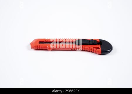 red utility knife on white background Stock Photo