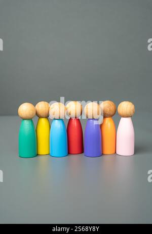 Multi-colored figures of people stand in a row. Multiculturalism and diversity. Standing united. Celebrating unique identities, fostering global unity Stock Photo