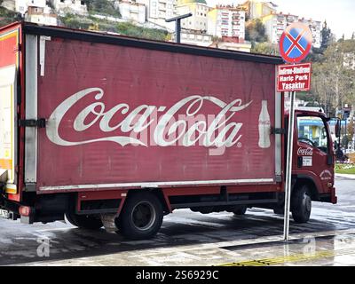 Istanbul, Turkiye - November 21, 2024: A faded red Coca-Cola Company delivery truck is parked on the side of the road Stock Photo