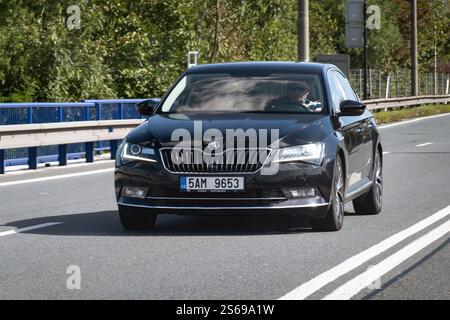 OSTRAVA, CZECH REPUBLIC - SEPTEMBER 21, 2023: Black Skoda Superb III car with slight motion blur effect Stock Photo