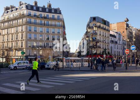 Paris, France, 01.13.2025. Place Blanche. Haussmannian apartments, tourists and street scene in the 18th arrondissement of Paris Stock Photo