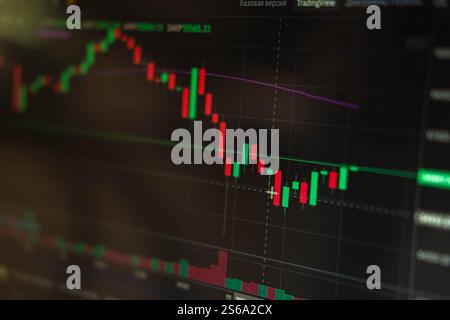 Financial chart, stock analysis data on digital screen. Cryptocurrency growth charts. Blur and selective focus Stock Photo