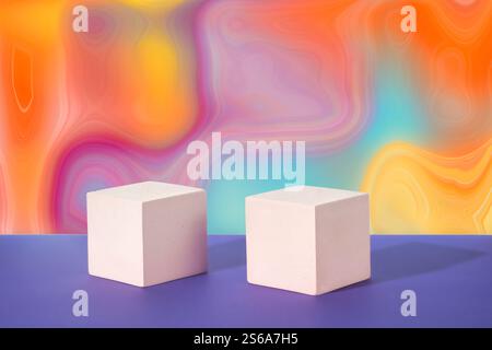 Cosmetic gradient rainbow background. Two white cubic podiums. Mockup for the demonstration of cosmetic products Stock Photo