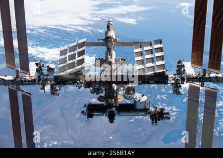 November 8, 2021: Earth Atmosphere, The International Space Station (ISS) is a large space station that was assembled and is maintained in low Earth orbit by a collaboration of five space agencies and their contractors: NASA (United States), Roscosmos (Russia), ESA (Europe), JAXA (Japan), and CSA (Canada). As the largest space station ever constructed, it primarily serves as a platform for conducting scientific experiments in microgravity and studying the space environment. The station is divided into two main sections: the Russian Orbital Segment (ROS), developed by Roscosmos, and the US Orbi Stock Photo