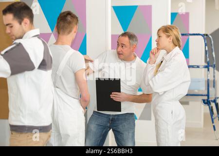 tutor and students on decorating course Stock Photo