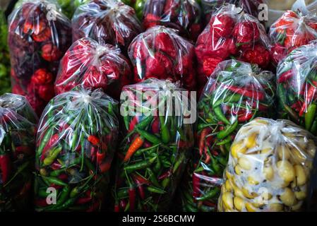 Peppers in a plastic bag for sale at a stand. Healthy eating Stock Photo