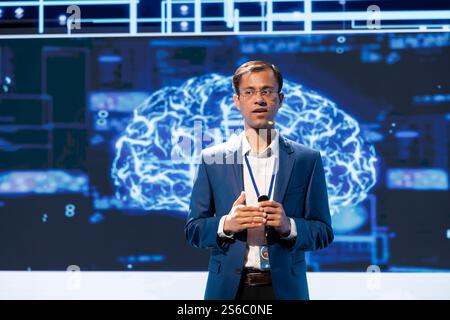 CEO presenting how AI technologies can bring increased productivity and innovation in business sector during conference. Businessman talking about implementation of AI driven solutions Stock Photo