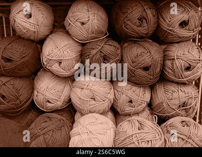 Colorful of Yarn Balls Wool in a Fabric Shop. Background from colored acrylic yarn. Skeins of thread close-up. Materials for needlework, for knitting Stock Photo