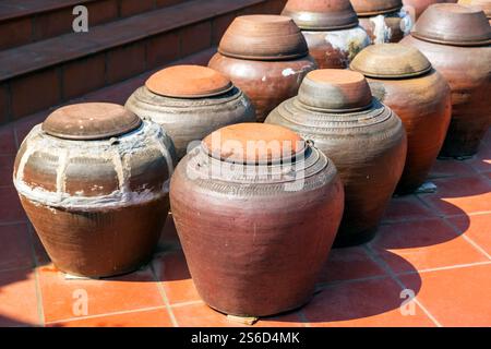 Traditional clay pots arranged on tiled floor at Mia Pagoda, Ha Tay, Vietnam, Friday, November 01, 2024. Photo: David Rowland / One-Image.com Stock Photo