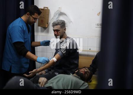 Gaza. 16th Jan, 2025. Two injured men receive treatment at the Al-Ahli Arabi Baptist Hospital, following an Israeli airstrike in Gaza City, on Jan. 16, 2025. Israel and Hamas have agreed to a Gaza ceasefire-for-hostages deal following intensive mediation by Qatar, Egypt, and the United States, Qatar's prime minister announced on Wednesday. Israeli far-right National Security Minister Itamar Ben-Gvir announced Thursday that his party will quit the government if the newly announced Gaza ceasefire agreement is approved. Credit: Abdul Rahman Salama/Xinhua/Alamy Live News Stock Photo