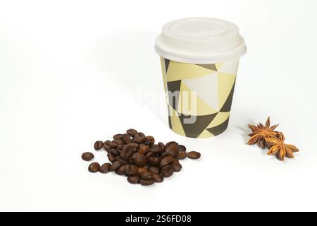 Cardboard coffee cup with coffee beans and star anise isolated on white background and copy space Stock Photo