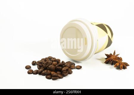 Cardboard coffee cup with coffee beans and star anise isolated on white background and copy space Stock Photo