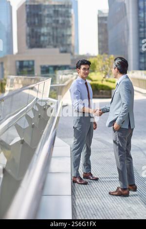 Business associates shaking hands Stock Photo