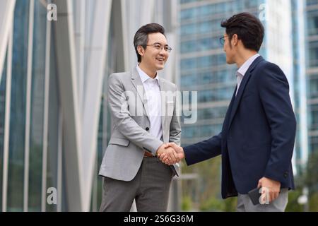 Business associates shaking hands Stock Photo