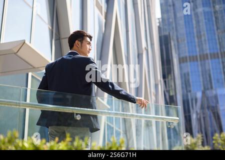 Young businessman looking at view Stock Photo