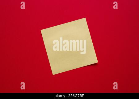 Top view of yellow sticky note paper on blue background Stock Photo
