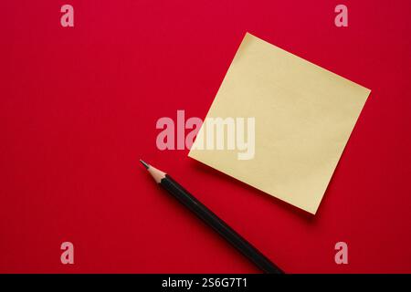 Top view of yellow sticky note paper on blue background Stock Photo