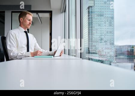 Busy professional business man manager using laptop working at table. Stock Photo