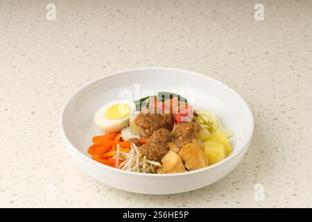 Gado Gado, Indonesian traditional vegetable salad with peanut sauce, rice cake, tofu and egg Stock Photo