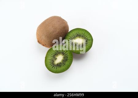 Fresh kiwi fruits served in rattan basket on wooden background Stock Photo